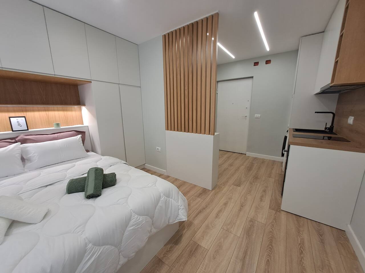 Full studio view showing open layout with kitchen and living area